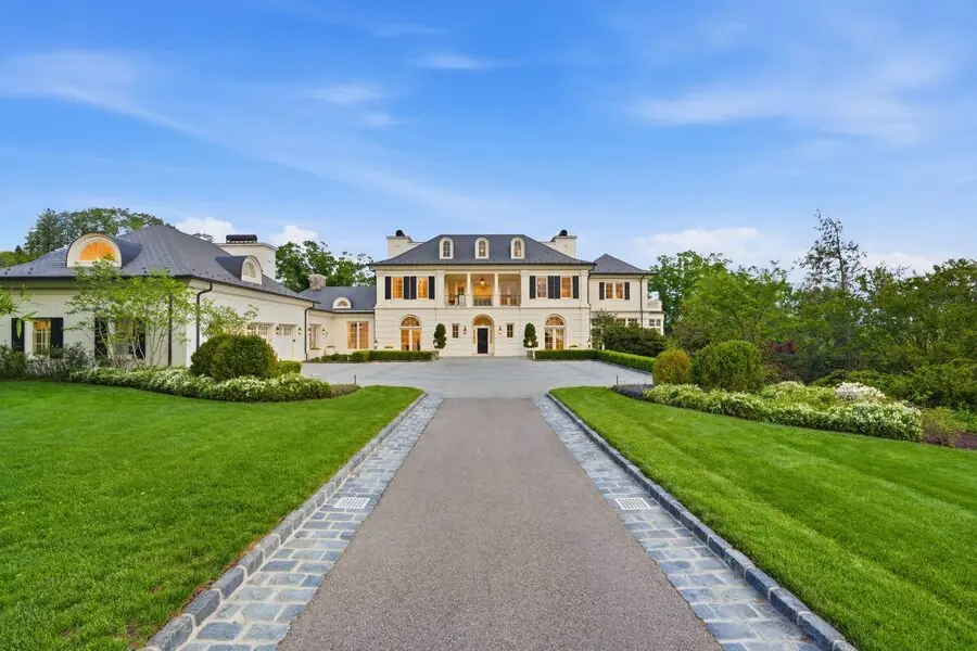 The long stone-banded driveway from above