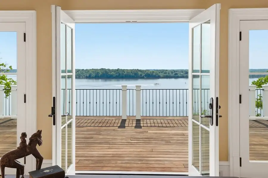 French doors opening to the river-view porch