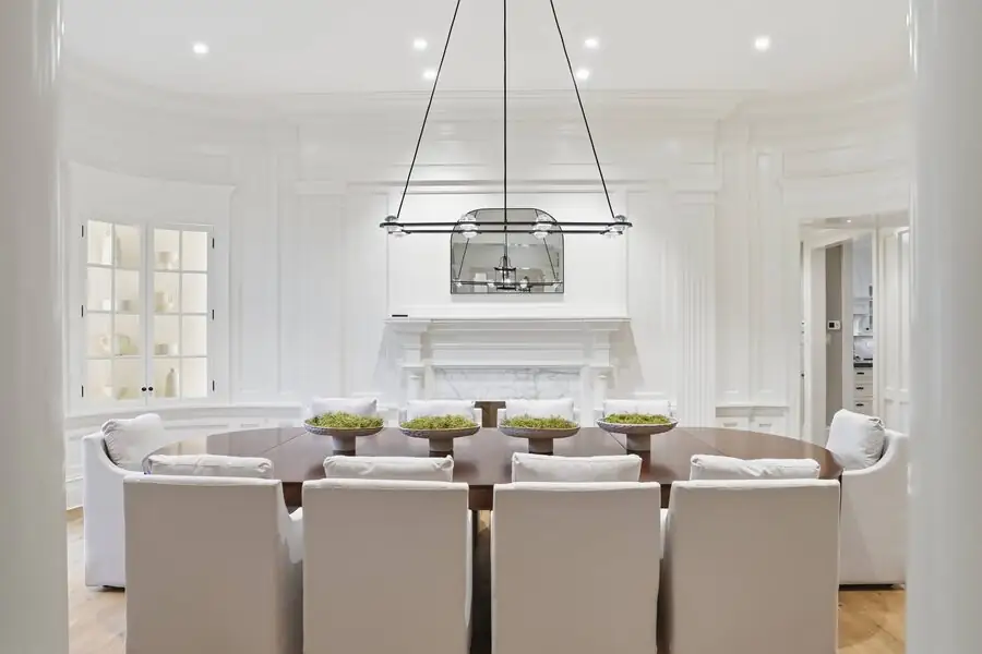 Dining alongside the kitchen, linear chandelier