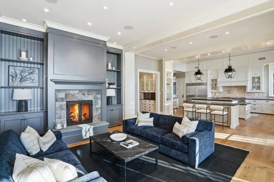 Marble fireplace with dark built-ins