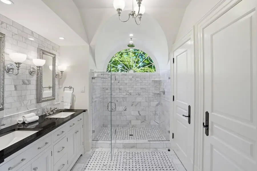 Marble bath with arched walk-in shower