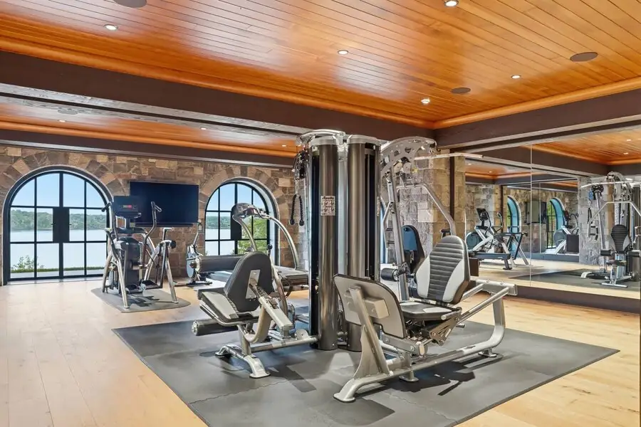 Home gym with stone arches